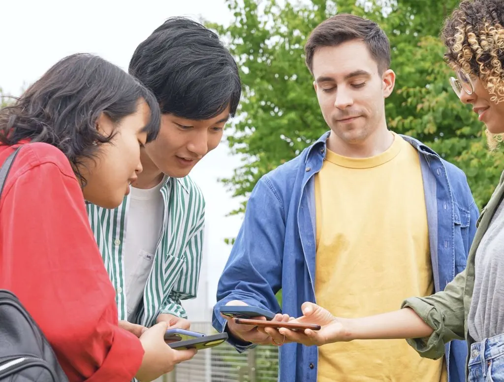 Couple getting help from locals using google translate