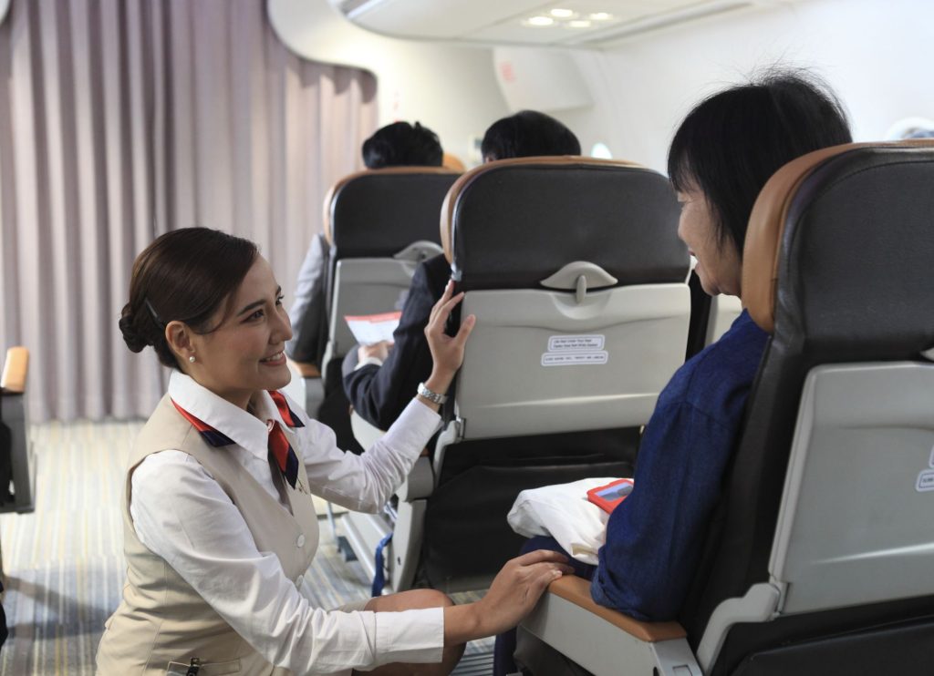 Flight Attendant Reassuring Passenger