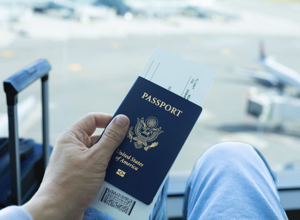 US Passport in hand at airport