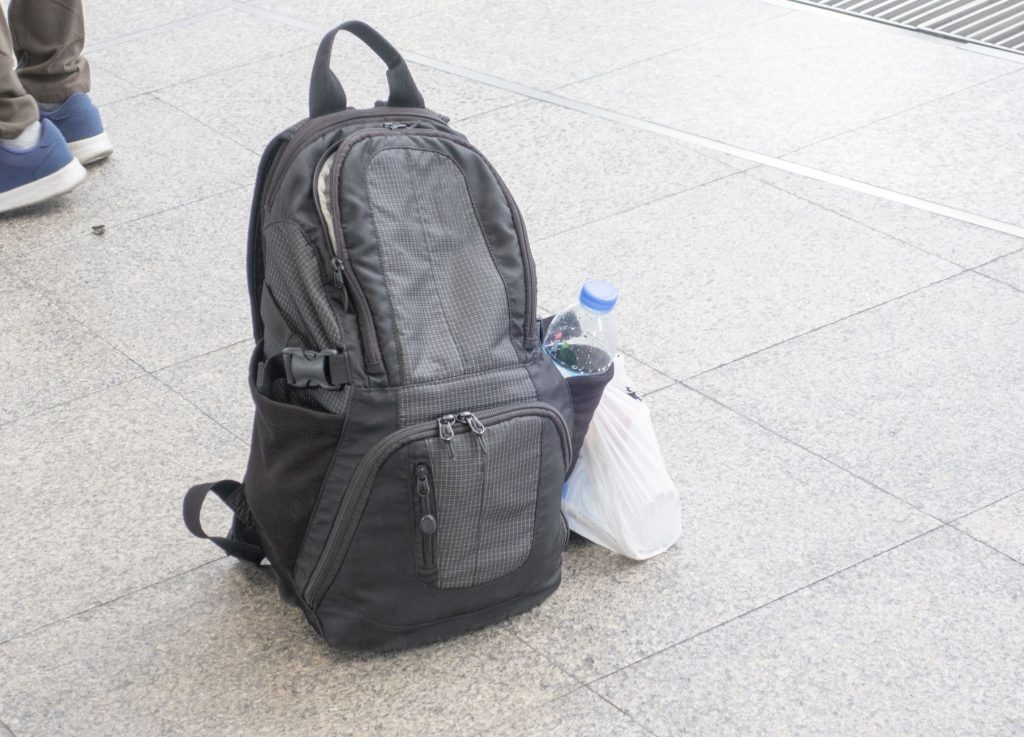 Unattended backpack on street.